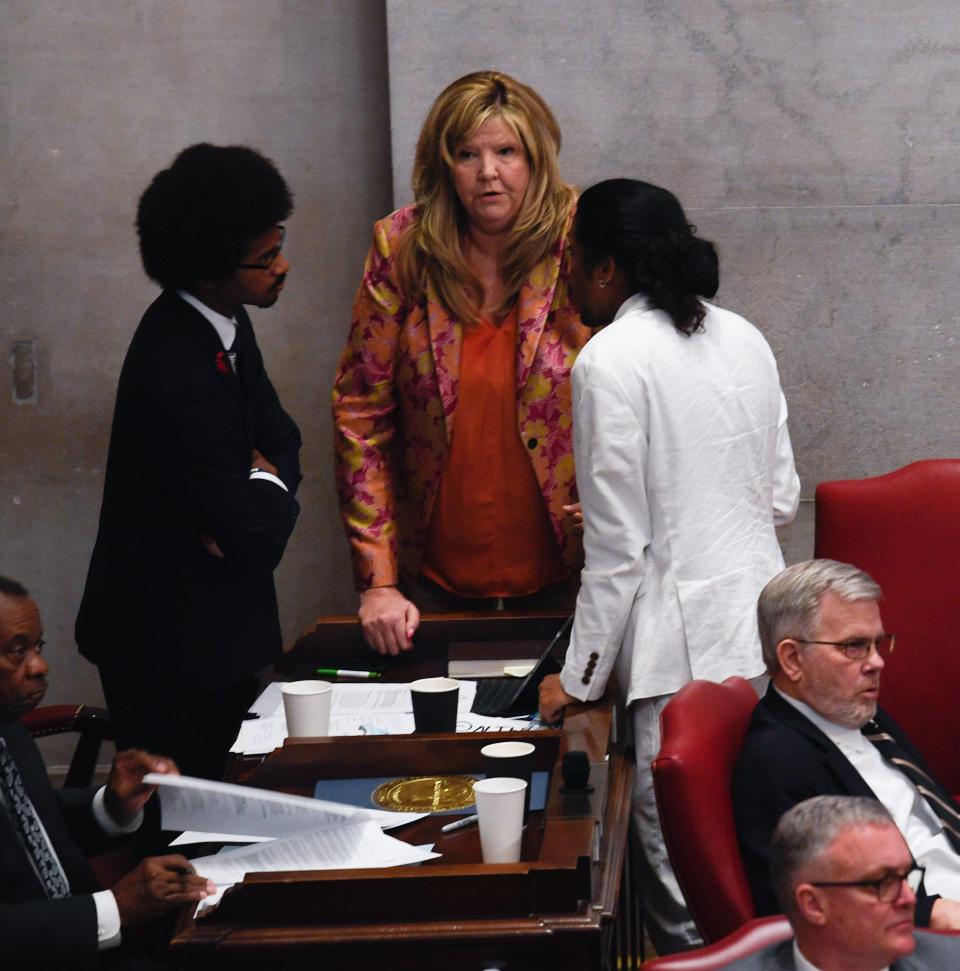 Justin Pearson, D-Memphis, Gloria Johnson, D-Knoxville and Justin Jones, D-Nashville, speak with each other at the Tennessee State Capitol in Nashville, Tenn., on Thursday, April 6, 2023. GOP representatives are expected to vote on expelling them today.