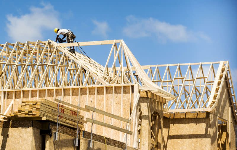 FILE PHOTO: A construction worker works on a new house being built in Vaughan