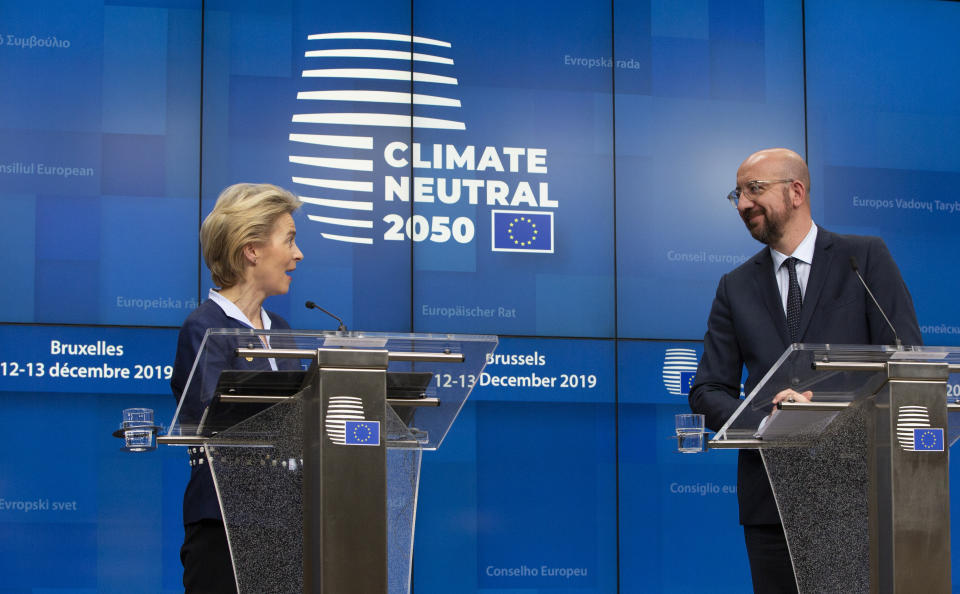 European Council President Ursula von der Leyen, left, and European Council President Charles Michel participate in a media conference during an EU summit in Brussels, Friday, Dec. 13, 2019. European Union leaders gathered for their year-end summit and discussed climate change funding, the departure of the UK from the bloc and their next 7-year budget. (AP Photo/Virginia Mayo)