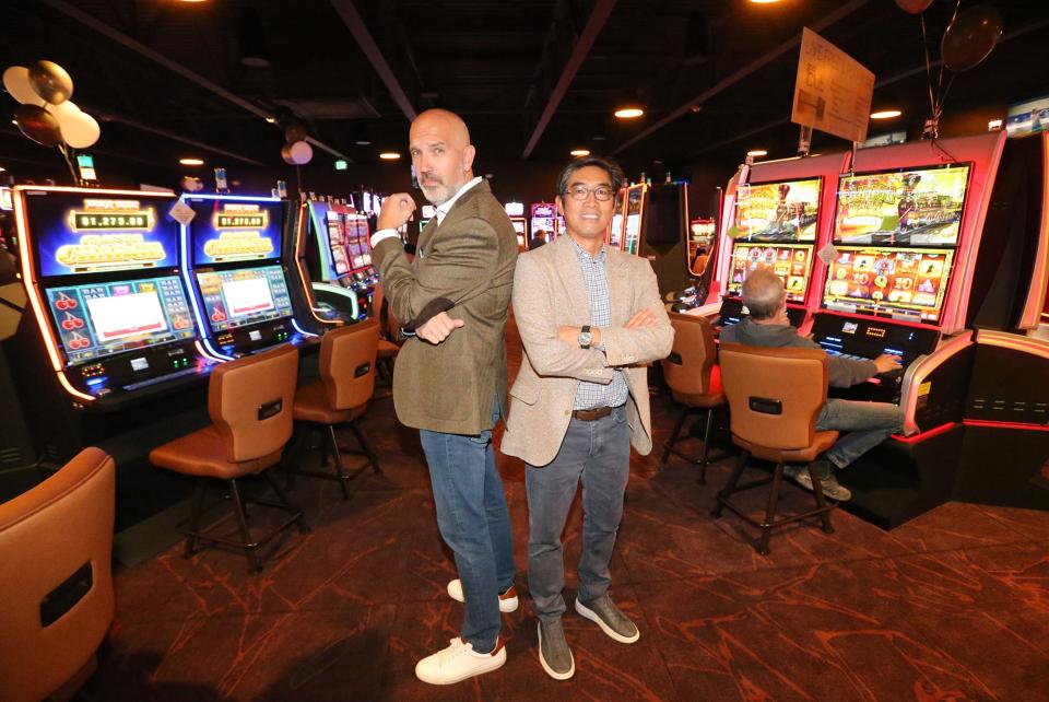 Partners Andre Carrier, left, and Greg Lee show off the latest additional game room at The Brook casino in Seabrook.