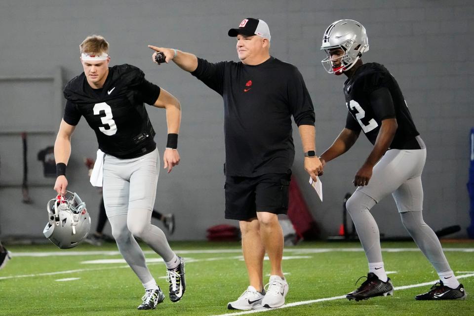 Mar 5, 2024; Columbus, OH, USA; Ohio State Buckeyes offensive coordinator Chip Kelly works with quarterbacks Lincoln Kienholz (3) and Air Noland (12) during the first spring practice at the Woody Hayes Athletic Center.
