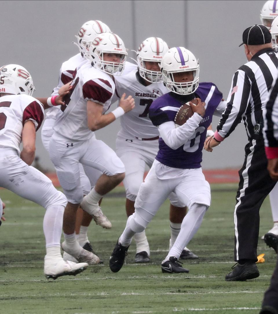 New Rochelle's Reyden Davis carries the ball for some yards against Scarsdale, during their football game at New Rochelle High School, Oct. 1, 2022. 