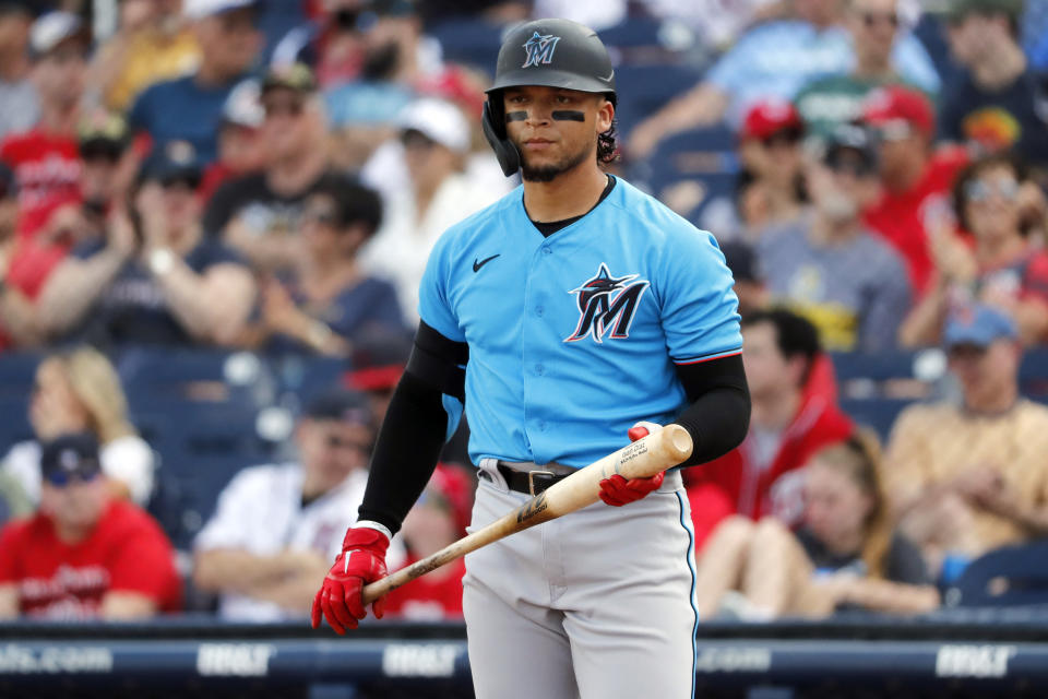 FILE - In this March 2, 2020, file photo, Miami Marlins' Isan Diaz bats during the second inning of a spring training baseball game against the Washington Nationals in West Palm Beach, Fla. The Marlins received no new positive results in their latest round of coronavirus testing, a person familiar with the situation said Saturday, but second baseman Isan Diaz decided to opt out of the season. (AP Photo/Jeff Roberson, File)