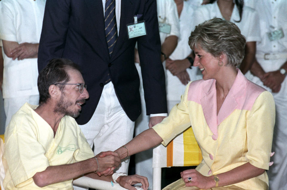 Britain's Princess Diana meets an AIDS patient at the hospital of the
Federal University of Rio de Janeiro on April 25, 1991. The Prince and
Princess of Wales are on a five day official visit to Brazil.
REUTERS/Vanderlei Almeida

AS