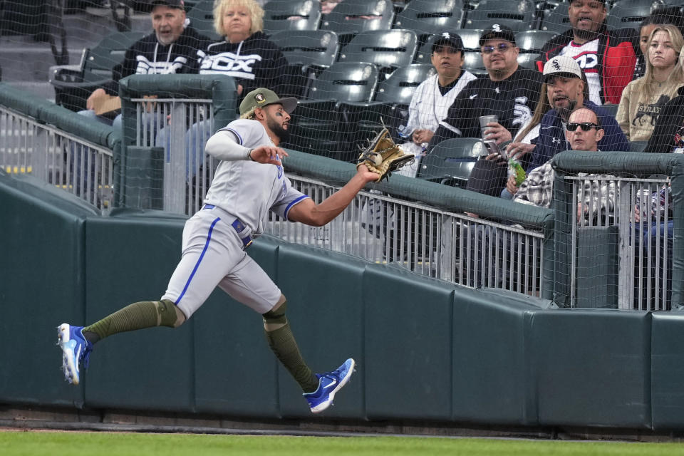 Kansas City Royals' MJ Melendez makes a running catch of a deep fly ball in foul territory hit by Chicago White Sox's Tim Anderson during the first inning of a baseball game Friday, May 19, 2023, in Chicago. (AP Photo/Charles Rex Arbogast)