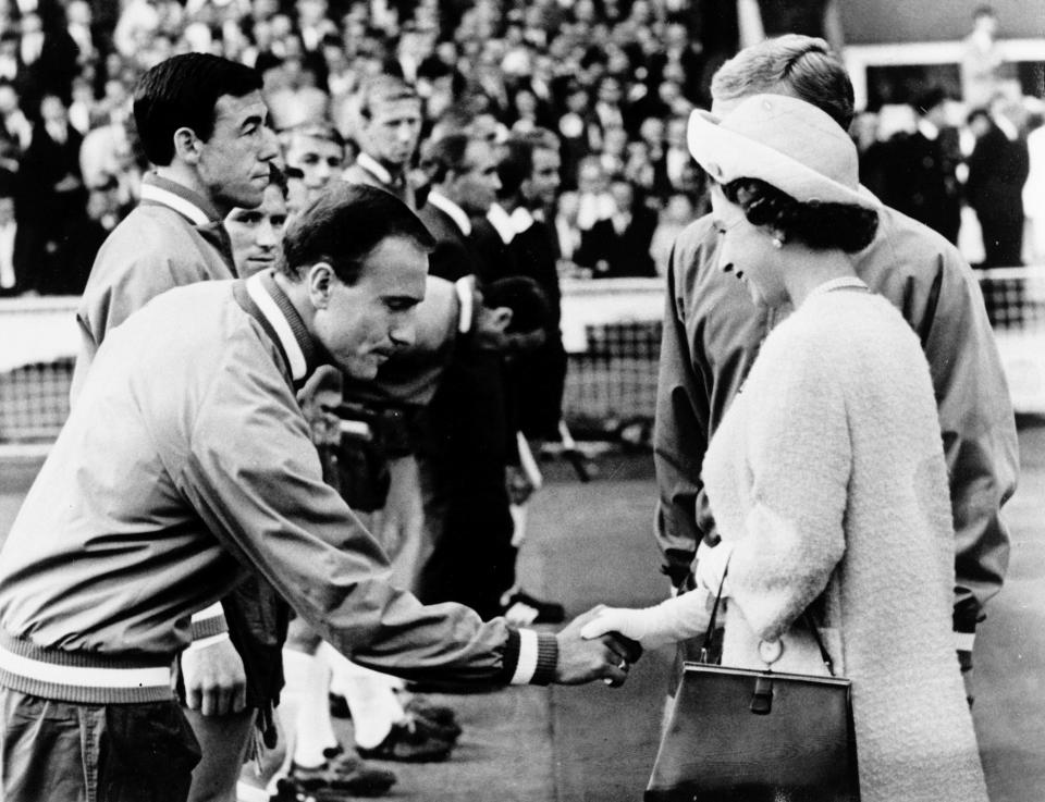 Seen here, England defender George Cohen bows his head as he shakes hands with Queen Elizabeth II after his side's 1966 World Cup triumph at Wembley Stadium.