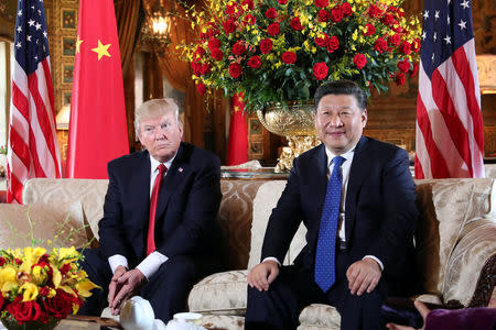 President Donald Trump welcomes Chinese President Xi Jinping at Mar-a-Lago state in Palm Beach, Florida. REUTERS/Carlos Barria