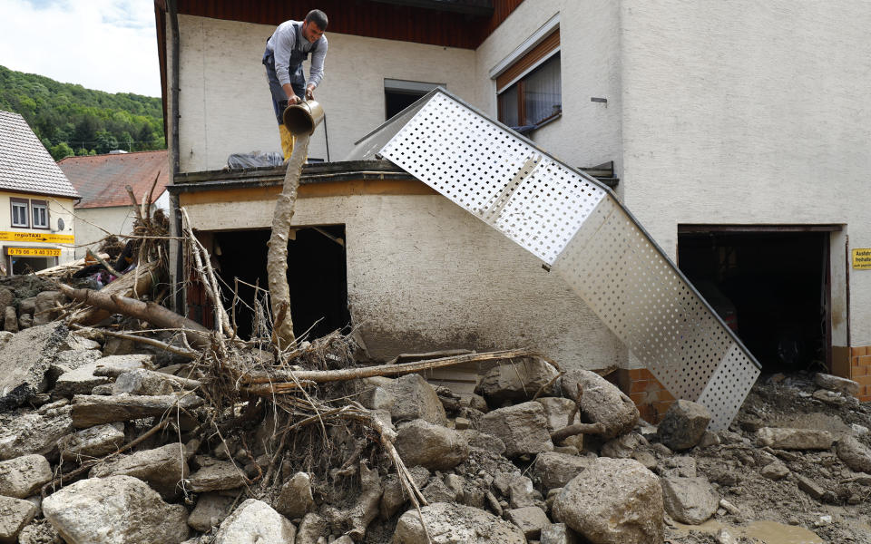 <p>A man looks at the damage on May 30, 2016, that was caused by floods in Braunsbach, in Baden-Wuerttemberg, Germany. (Kai Pfaffenbach/Reuters) </p>