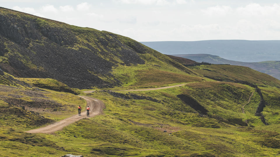 Two gravel riders climbing Moresdale Ridge