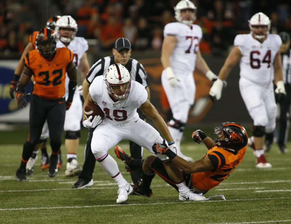 Stanford wide receiver JJ Arcega-Whiteside sheds an Oregon State defender during the first half of an NCAA college football game, in Corvallis, Ore., Thursday, Oct. 26, 2017. (AP Photo/Timothy J. Gonzalez)