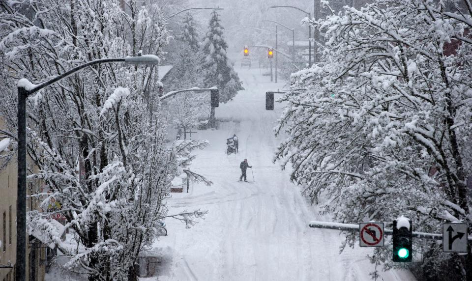 A man skis across 10th Ave near Willamette St. during the storm Feb. 25, 2019. Forecasters warned that a similar storm could hit Eugene this weekend.