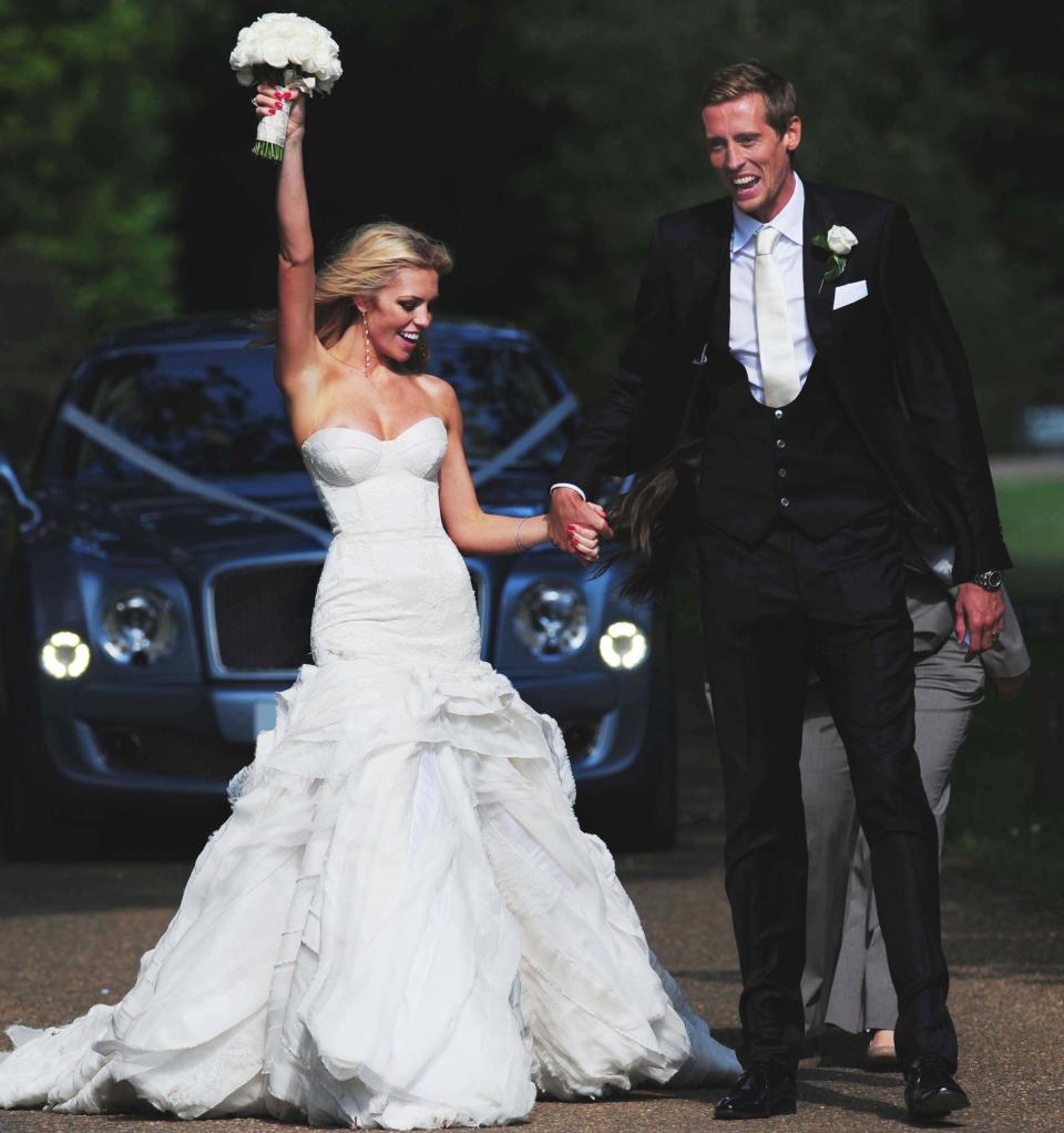 Footballer Peter Crouch and model Abbey Clancy in the grounds of Stapleford Park in Leicester following their wedding.