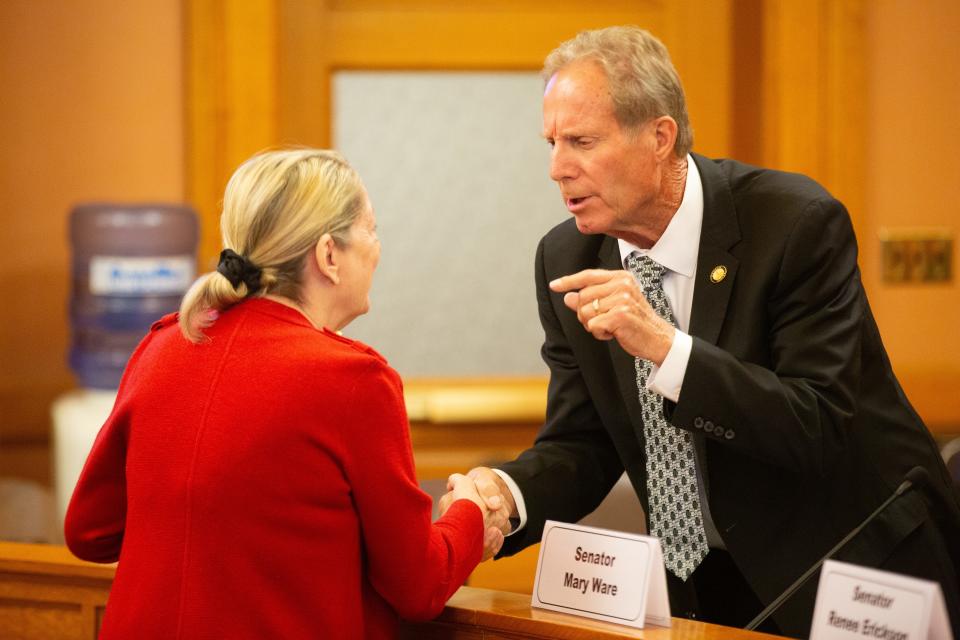 Annie Kuether, appointee for the KCC commission chair, shakes hands with Sen. Rick Billinger, R-Goodland, following her confirmation hearing Wednesday.