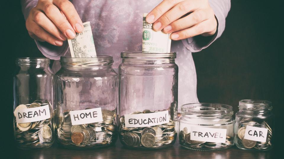 Hand's women putting coin in money jar with text .