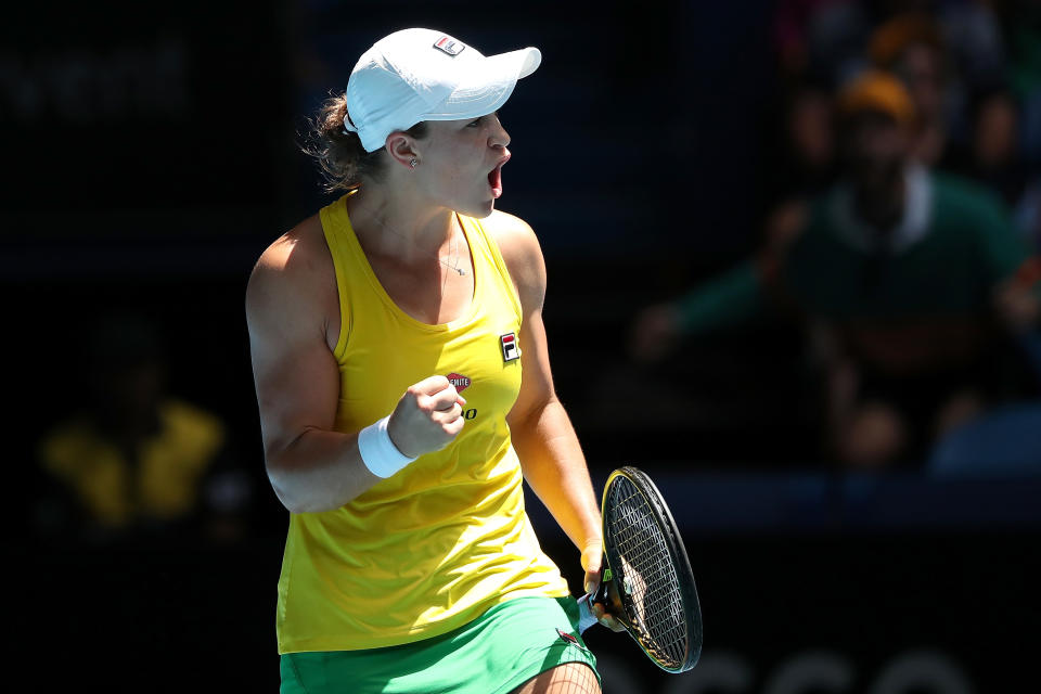 ash Barty of Australia celebrates winning a point.