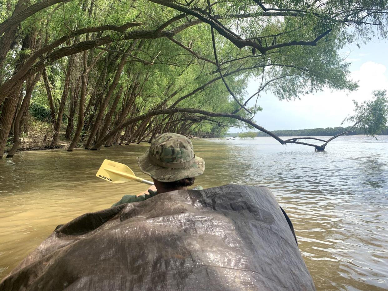 Charlie Montuori paddles along the banks of the Mississippi River near Waterproof, La., in July 2020.