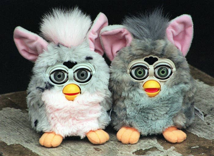 Two furbies on table next to each other