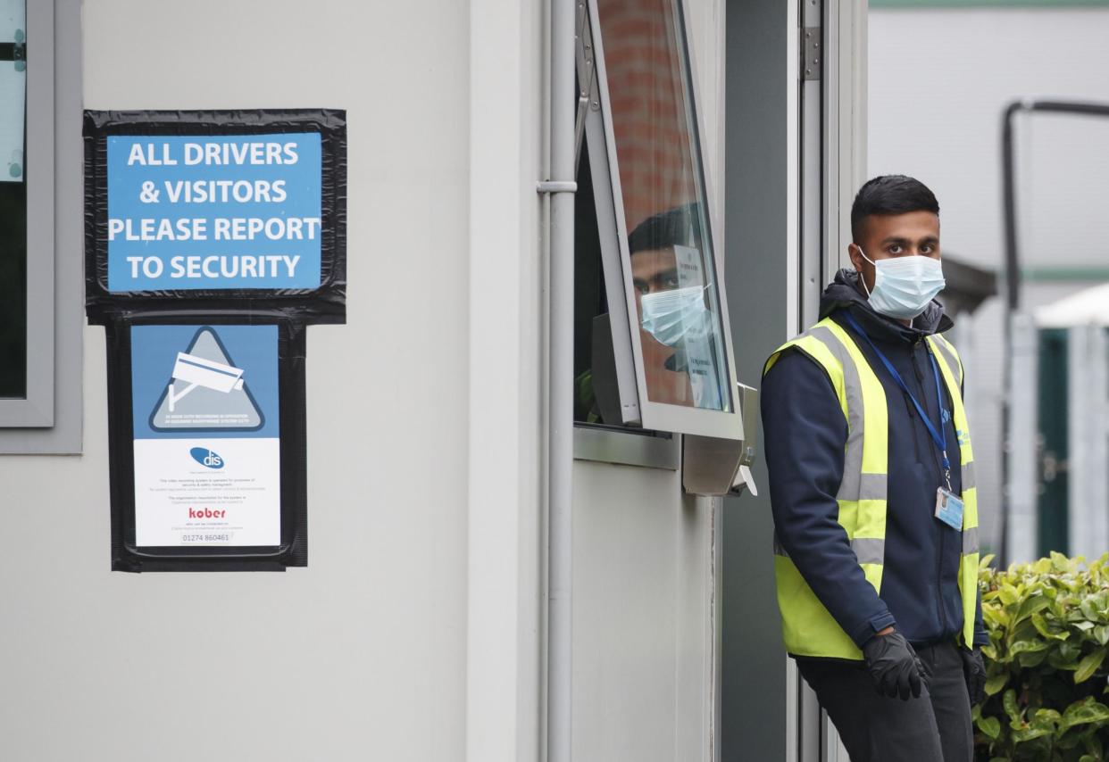 A security guard at Kober meat processing plant in Cleckheaton: PA