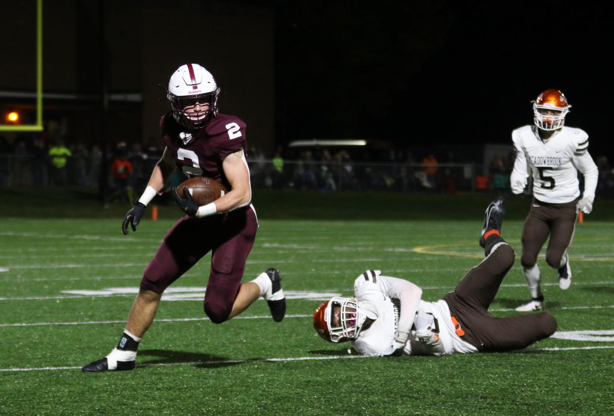 John Glenn's Colt Emerson eludes a Meadowbrook defender. Emerson made the Division IV All-Ohio first team, which was announced on Tuesday.