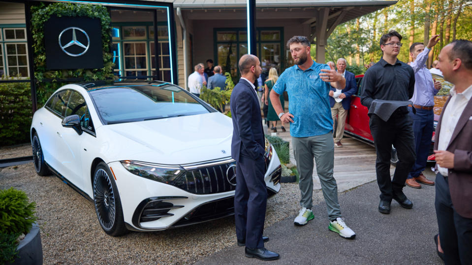 Golfer Jon Rahm mingles with guests of Mercedes-Benz at a reception presenting examples of the new GLE-Class at Augusta during the week of the 2023 Masters Tournament.