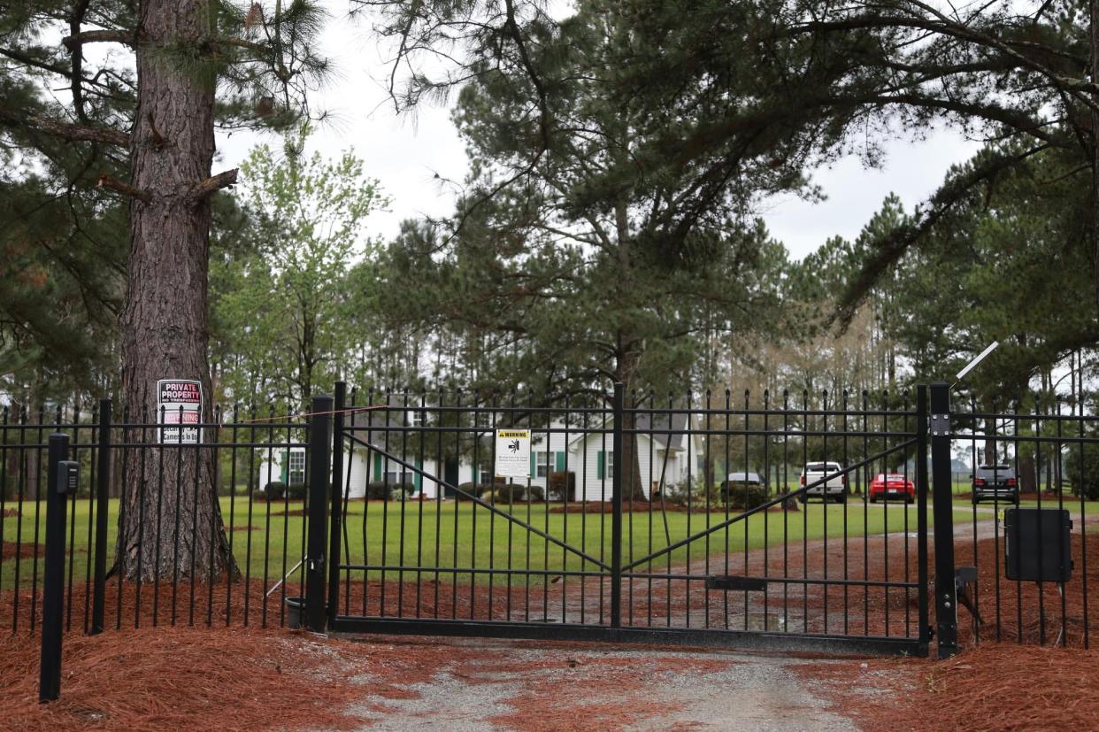 The home of Jorge Gomez in Douglas, Ga., has a locked gate with a sign alerting to security cameras on the property. Officers seized $5,306 in cash at Gomez’s home, according to a court filing. The filing says the money was seized from his daughter Graciela Gomez.