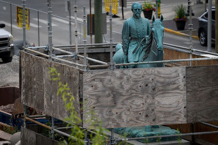 A monument to Confederate General John Hunt Morgan stands encased in a protective scaffolding because of local construction, outside the Historic Lexington Courthouse in Lexington, Ky., U.S., August 15, 2017. REUTERS/Bryan Woolston