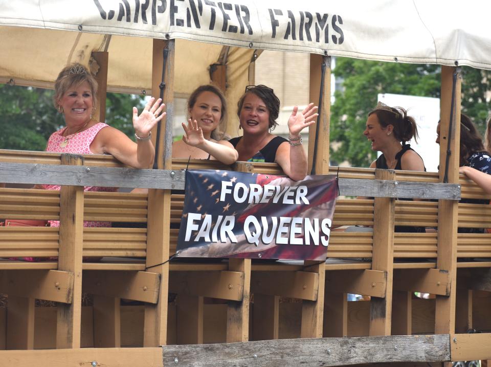 Lenawee County Forever Fair Queens ride in the annual Lenawee County Fair Parade Sunday, July 24. The float transporting the fair queen titleholders through downtown Adrian and to the Lenawee County Fair & Event Grounds was provided by Carpenter Farms in Madison Township.