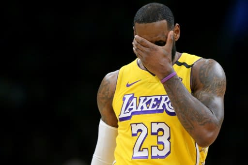 Los Angeles star LeBron James reacts during the Lakers' blowout NBA loss to the Boston Celtics