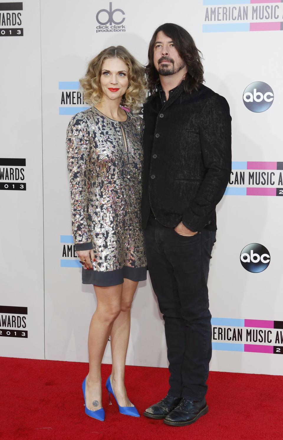 Musician Grohl of the Foo Fighers and his wife Jordyn arrive at the 41st American Music Awards in Los Angeles