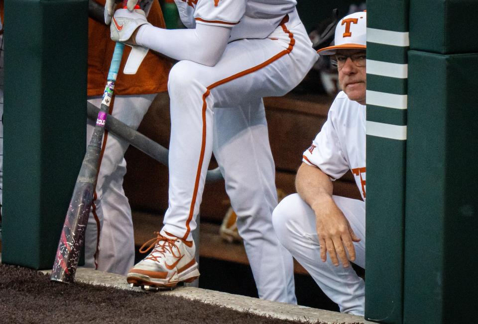 Texas baseball coach David Pierce watches from the dugout during Friday night's loss to TCU. His ejection during Sunday's win over the Horned Frogs sparked his two-game suspension this week.
