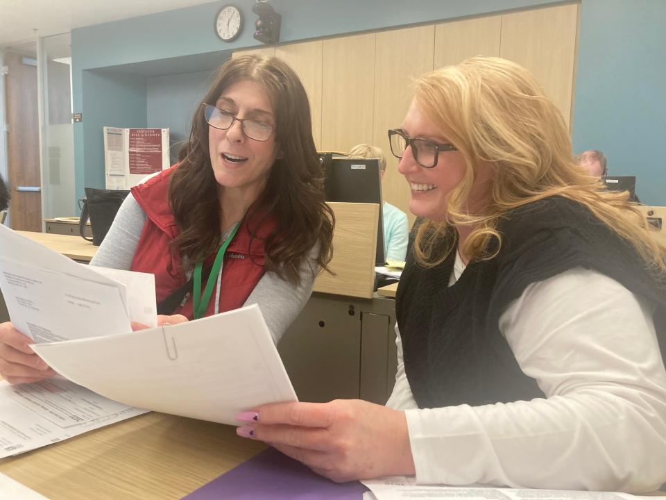 Chandler resident Wendy Richardson (right) receives free in-person tax help from VITA volunteer Tricia Hulin in Scottsdale in February 2023.