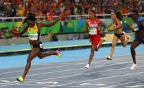 2016 Rio Olympics - Athletics - Final - Women's 200m Final - Olympic Stadium - Rio de Janeiro, Brazil - 17/08/2016. Elaine Thompson (JAM) of Jamaica competes on her way to winning the gold medal. REUTERS/Kai Pfaffenbach