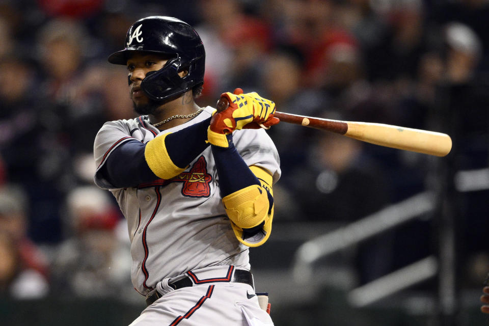 FILE - Atlanta Braves' Ronald Acuna Jr. in action during a baseball game against the Washington Nationals on Sept. 28, 2022, in Washington. Acuna, who has been cleared to play in the World Baseball Classic, was taking swings at the team's spring training camp on Wednesday, getting an early start on a season with high expectations. (AP Photo/Nick Wass, File)