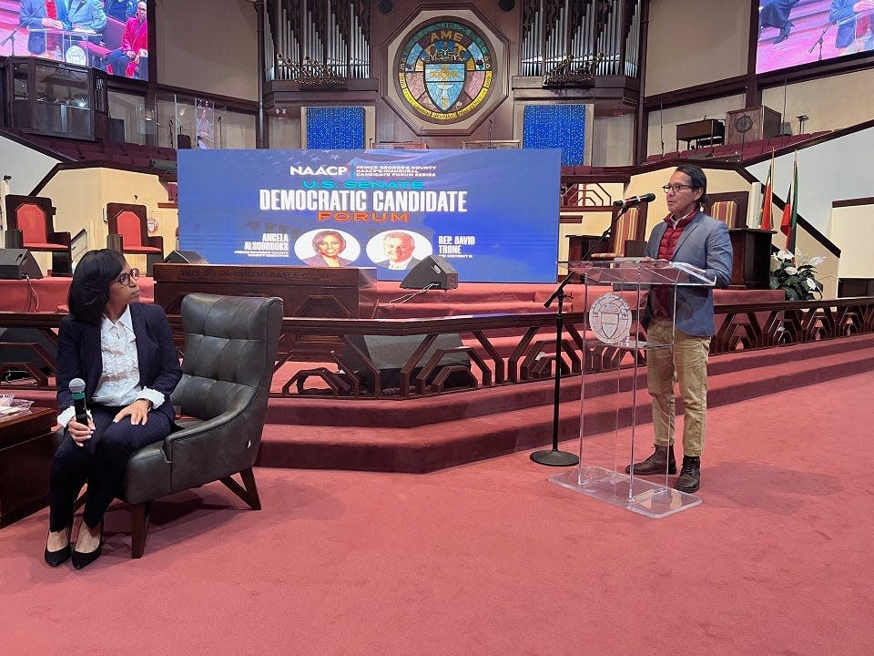 Prince George's County Executive Angela Alsobrooks, left, listens to a question about immigration policy from audience member Ted Loza, right, during a U.S. Senate Democratic candidate forum in Fort Washington, Maryland on March 8, 2024.