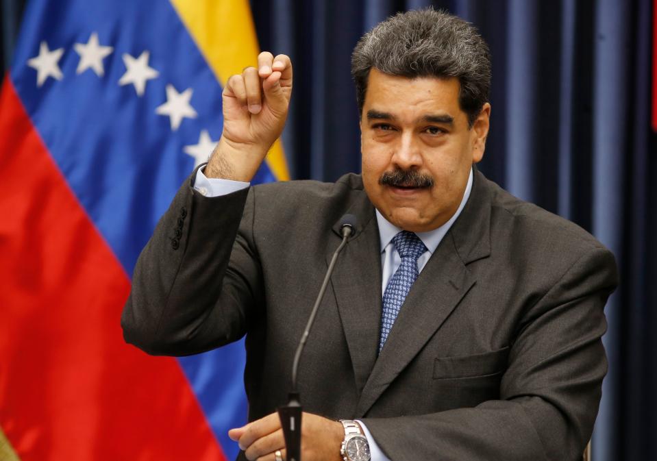 Venezuela's President Nicolas Maduro demonstrates his Salt Bae sprinkling technique during a press conference at the Miraflores Presidential Palace, in Caracas, Venezuela, Tuesday, Sept. 18, 2018. Maduro demonstrated the technique after speaking about the invitation to the famed Nusr-Et steakhouse in Istanbul when he stopped over briefly in Turkey on the way home from a trip to China.