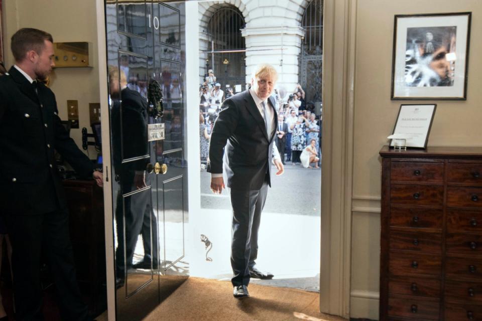 Britain's New Prime Minister Boris Johnson is welcomed into 10 Downing Street by staff (AP)