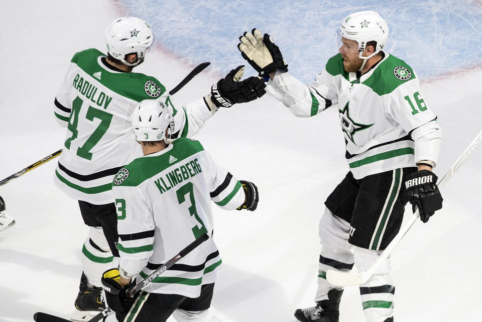 FILE - Dallas Stars' Alexander Radulov (47), John Klingberg (3) and Joe Pavelski (16) celebrate a goal against the Colorado Avalanche during the second period of an NHL hockey Western Conference playoff game in Edmonton, Alberta, in this Monday, Aug. 24, 2020, file photo. The Dallas Stars feel like they have something to prove after falling short in the Stanley Cup Final last season. The relish the opportunity for a better start this season and carry over the success they had in the NHL bubble. (Jason Franson/The Canadian Press via AP, File)