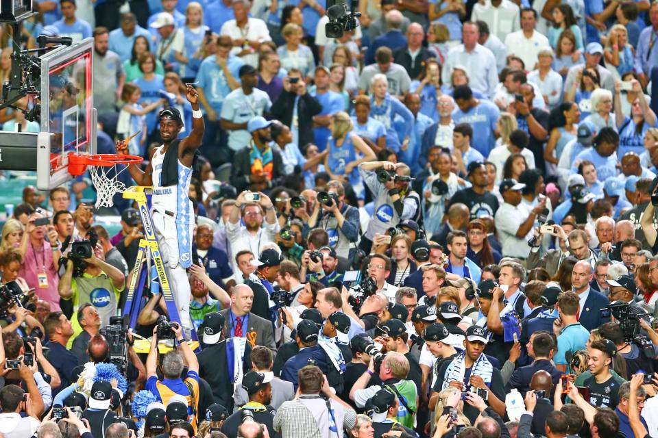 <p>North Carolina Tar Heels forward Theo Pinson (1) cuts the net after the game against the Gonzaga Bulldogs in the championship game of the 2017 NCAA Men’s Final Four at University of Phoenix Stadium. North Carolina defeated Gonzaga 71-65. Mandatory Credit: Mark J. Rebilas-USA TODAY Sports </p>