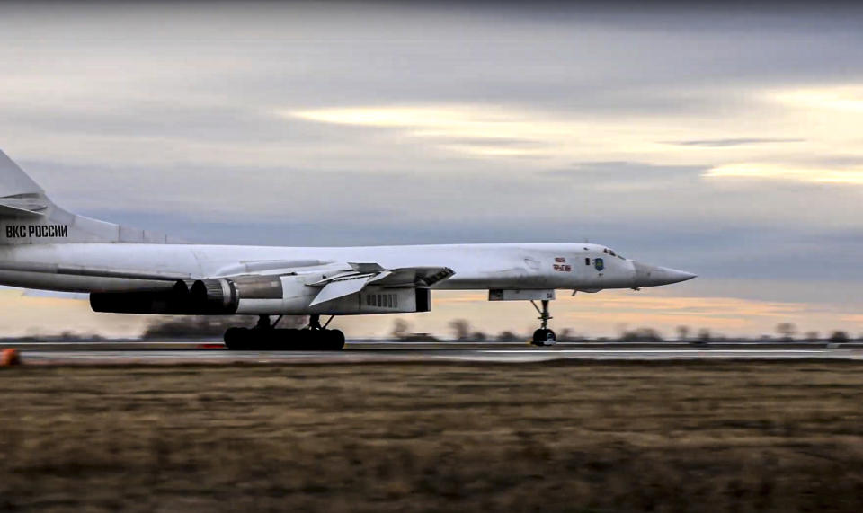 In this photo taken from video released by Russian Defense Ministry Press Service, a long-range Tu-160 bomber of the Russian Aerospace Forces lands after patrolling in the airspace of Belarus at an air field in Russia, Thursday, Nov. 11, 2021. Russia has sent two nuclear-capable strategic bombers on a training mission over Belarus in a show of Moscow's support for its ally amid a dispute over migration at the Polish border. Russia has supported Belarus amid a tense standoff this week as thousands of migrants gathered on the Belarus-Poland border in hopes of crossing into Europe. (Russian Defense Ministry Press Service via AP)