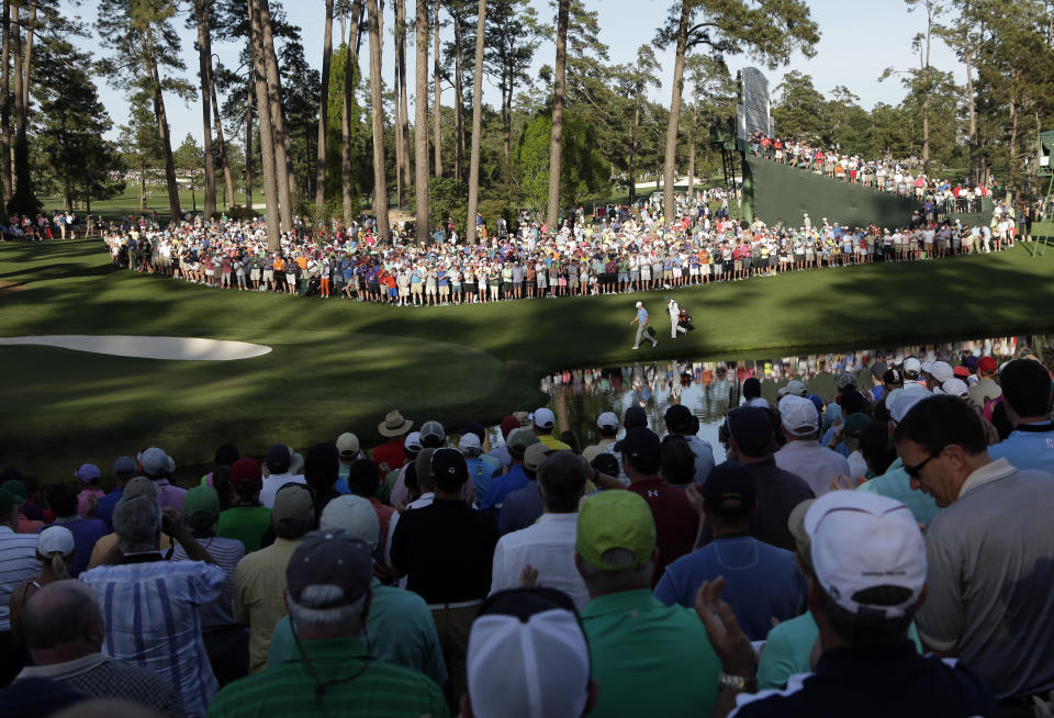 Jordan Spieth walks down the 16th fairway during the third round of the Masters golf tournament Saturday, April 11, 2015, in Augusta, Ga. (AP Photo/Charlie Riedel)