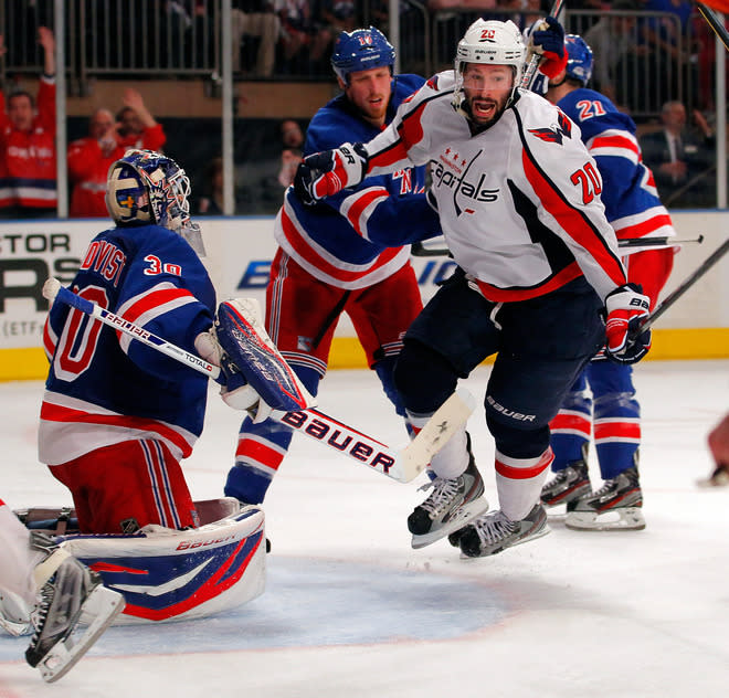 NEW YORK, NY - MAY 12: Troy Brouwer #20 of the Washington Capitals celebrates after Roman Hamrlik #44 scored a goal in the third period against goalie Henrik Lundqvist #30 of the New York Rangers in Game Seven of the Eastern Conference Semifinals during the 2012 NHL Stanley Cup Playoffs at Madison Square Garden on May 12, 2012 in New York City. (Photo by Paul Bereswill/Getty Images)