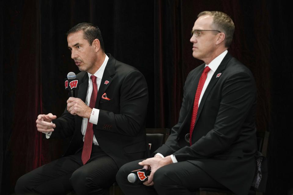 Luke Fickell speaks after being introduced as Wisconsin's new head football coach Monday, Nov. 28, 2022, in Madison, Wis. At right is athletic director Chris McIntosh. (AP Photo/Morry Gash)