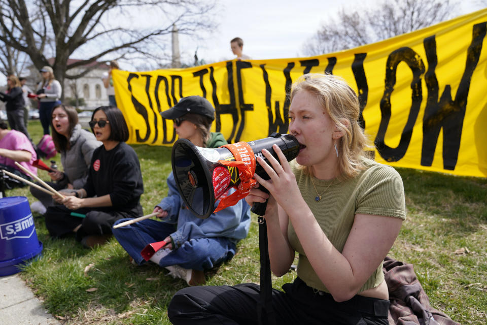 Demonstraters protest against the Biden administration's approval of the Willow oil-drilling project before a scheduled speech by Biden at the Department of the Interior in Washington, Tuesday, March 21, 2023. (AP Photo/Patrick Semansky)