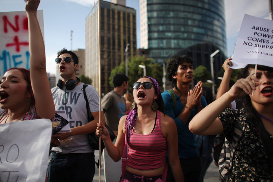 Students shout slogans during a demonstration to protest a possible return of the old ruling Institutional Revolutionary Party (PRI) in Mexico City, Wednesday, May 23, 2012. Demonstrators also protested against what students perceive as a biased coverage by major Mexican TV networks of the presidential elections campaign, which they claim to be directed in favor of PRI's candidate Enrique Pena Nieto. Mexico will hold presidential elections on July 1. (AP Photo/Alexandre Meneghini)