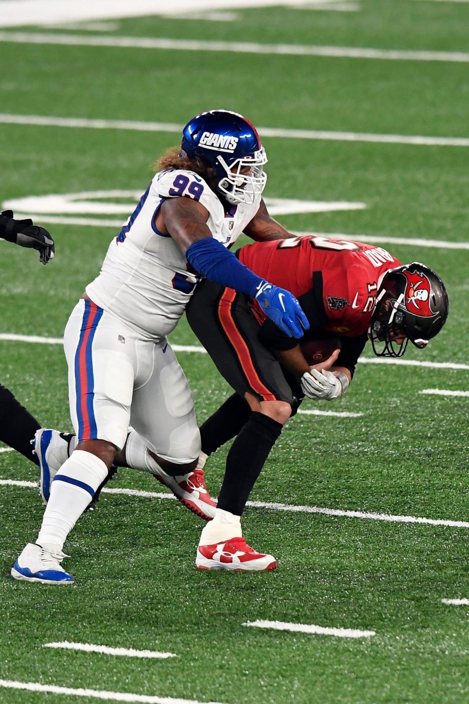 New York Giants defensive end Leonard Williams (99) sacks Tampa Bay Buccaneers quarterback Tom Brady (12) at MetLife Stadium on Monday, Nov. 2, 2020, in East Rutherford.