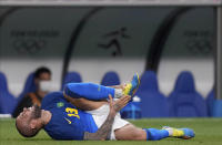 Brazil's Dani Alves reacts after being fouled during a men's soccer match against Saudi Arabia at the 2020 Summer Olympics, Wednesday, July 28, 2021, in Saitama, Japan. (AP Photo/Martin Mejia)