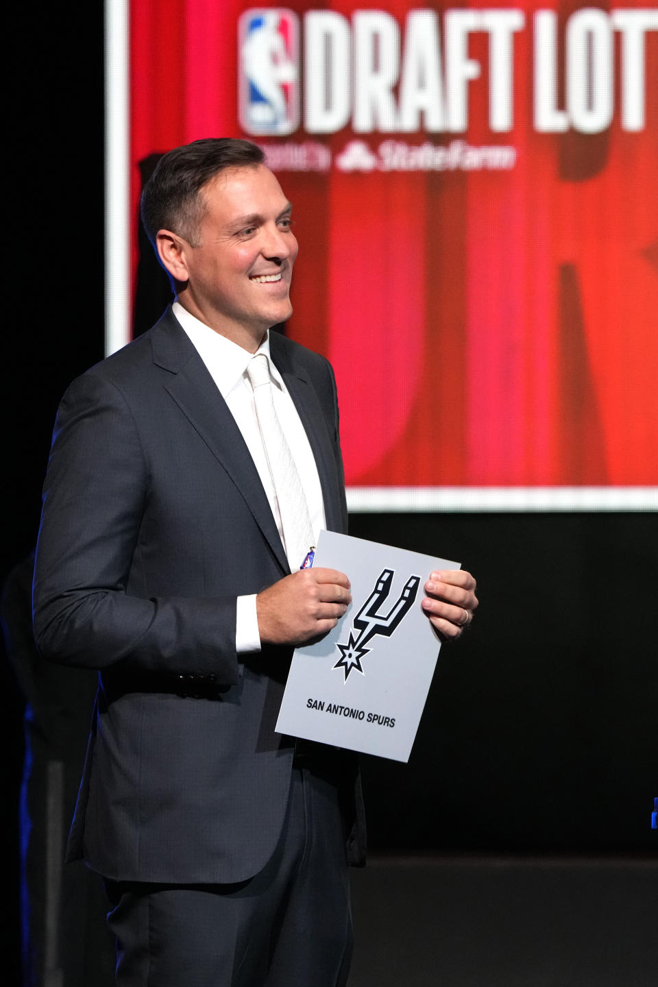 San Antonio Spurs managing partner Peter J. Holt smiles after NBA Deputy Commissioner Mark Tatum announced that the San Antonio Spurs have won the first pick in the 2023 NBA draft during the NBA basketball draft lottery in Chicago, Tuesday, May 16, 2023. (AP Photo/Nam Y. Huh)