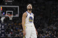Golden State Warriors guard Klay Thompson (11) walks on the court during the first half of an NBA basketball game against the Golden State Warriors, Sunday Jan. 16, 2022, in Minneapolis. (AP Photo/Stacy Bengs)