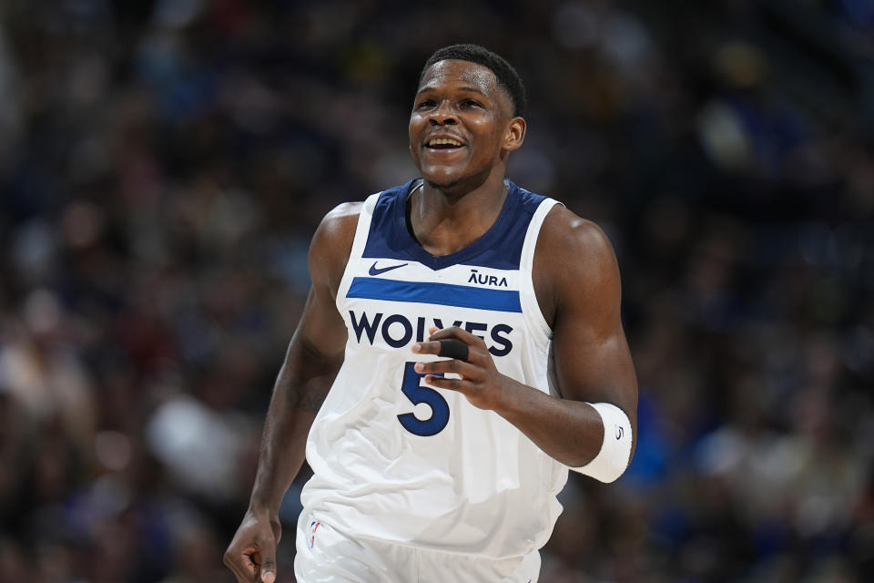 Minnesota Timberwolves guard Anthony Edwards reacts after hitting a basket in the first half of Game 1 of the NBA's second round playoff series against the Denver Nuggets, Saturday, May 4, 2024, in Denver.  (AP Photo/David Zalubowski)