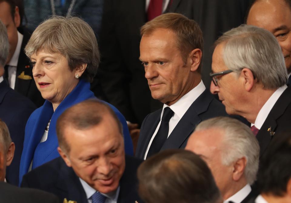 Prime Minister Theresa May (top left) stands next to Donald Tusk, president of the European Council and Jean-Claude Jucker, president of the EU Commission (Matt Cardy/Getty Images)